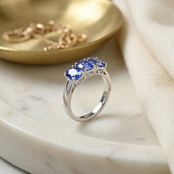 https://tjcuk.sirv.com/Products/83/5/8358317/Rhapsody-950-Platinum-AAAA-Tanzanite-Trilogy-Ring-4-00-Ct-Platinum-Wt-_8358317_3.jpg?w=342&h=342