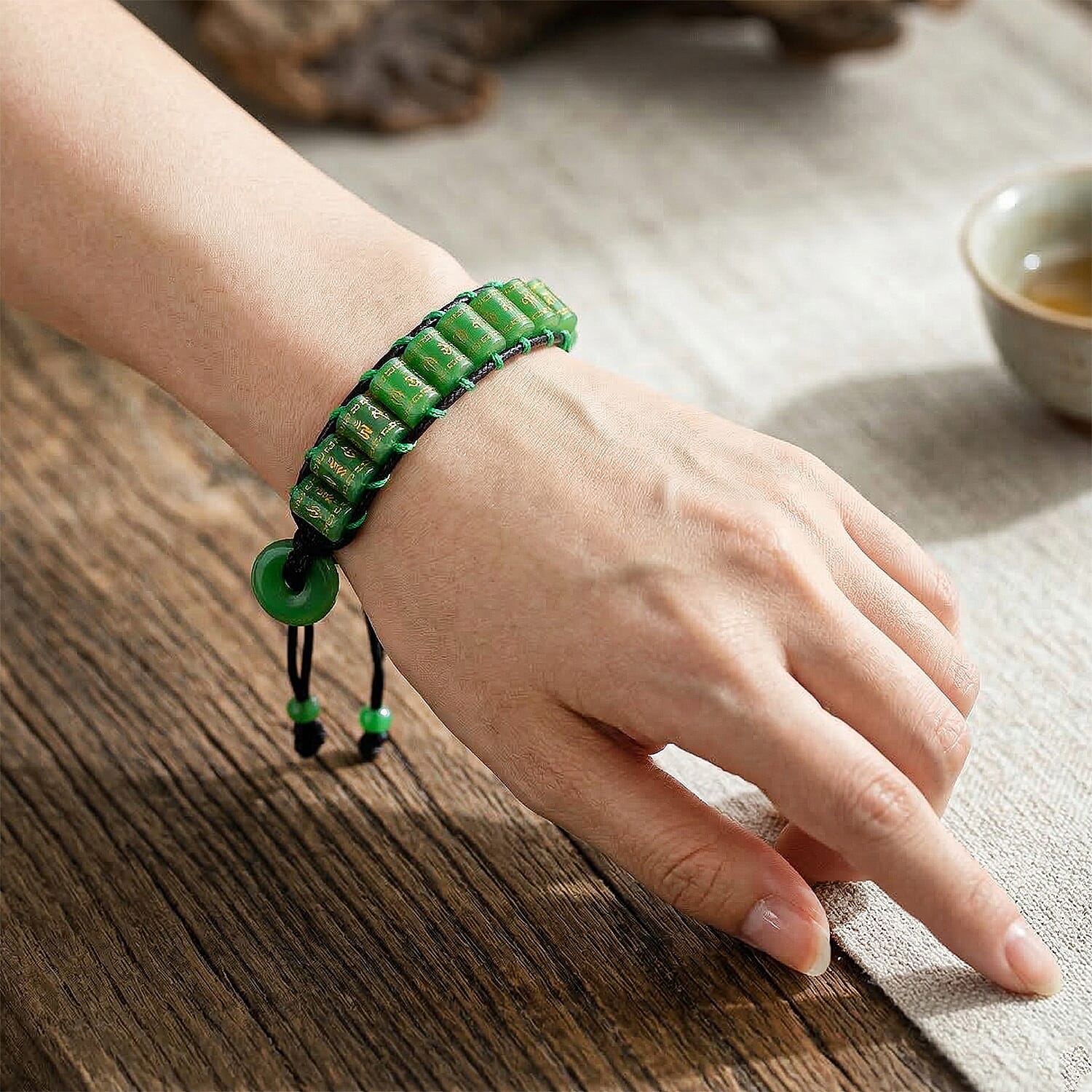 Enhanced Green Jade Barrel Adjustable Prayer Wheel Cord Bracelet (Size 6-9) 215.00 Ct.