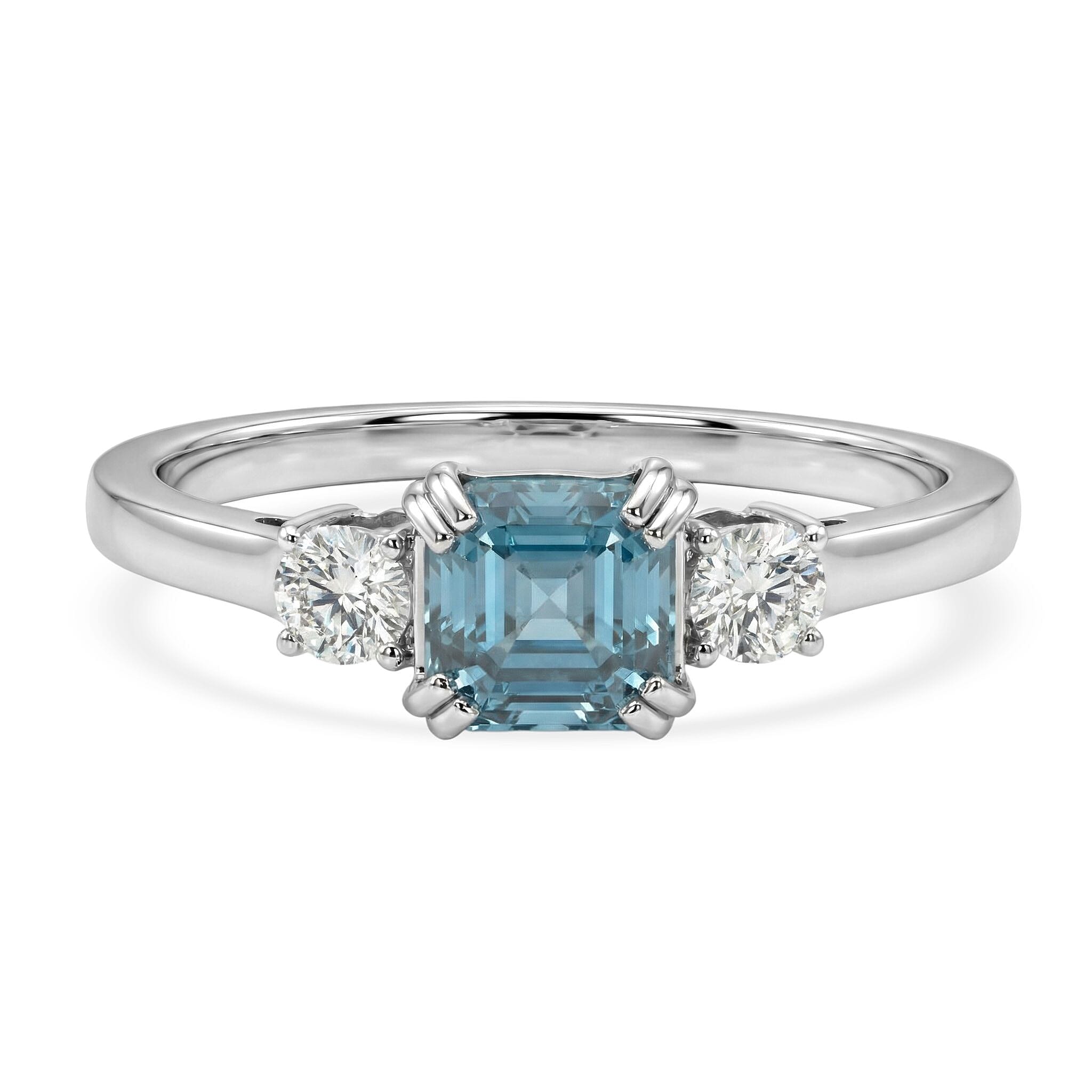 Luxuriant Lab Grown Diamond & Blue Zircon Three-Stone Emerald Cut Ring in Rhodium Overlay Sterling Silver 1.61 Ct.