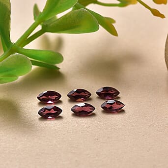 https://tjcuk.sirv.com/Products/85/1/8511566/Rhodolite-Garnet-Marquee-5X2-5-mm-Gemstone-1-15-Ct_8511566_1.jpg?w=342&h=342