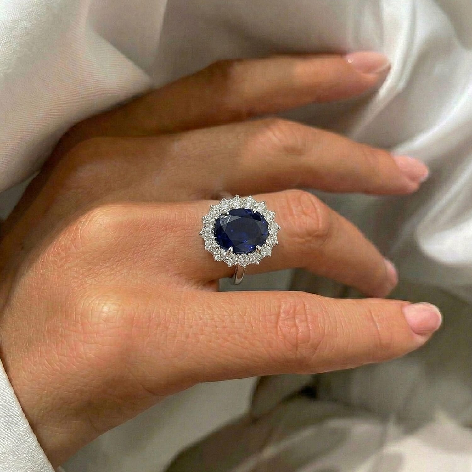 Luxuriant - Kanchanaburi Blue Sapphire (Oval 12x10 mm, 7.10Cts) & Lab Grown Diamond (SI-G-H, 1.00Cts) Halo Ring in Rhodium Overlay Sterling Silver 8.10 Ct.