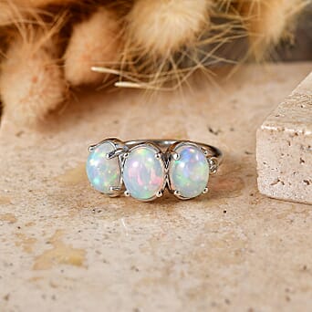 https://tjcuk.sirv.com/Products/86/0/8607610/Luxuriant-Ethiopian-Opal-Lab-Grown-Diamond-SI-G-H-Trilogy-Ring-in-Rhod_8607610_2.jpg?w=342&h=342