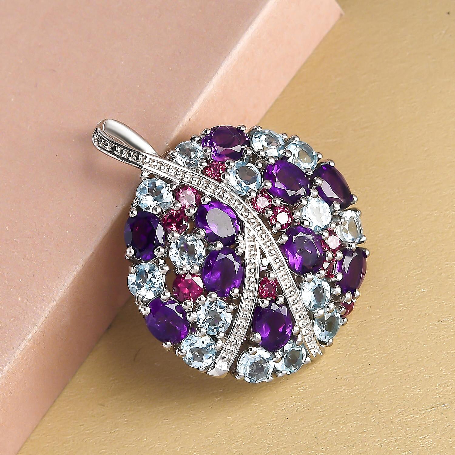 GP - Amethyst, Rhodolite Garnet, Blue Sapphire and Skyblue Topaz Pendant in Platinum Overlay Sterling Silver 7.26 Ct, Silver Wt. 5.21 Gms