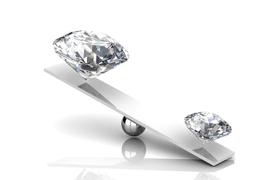 Diamonds balanced on a scale