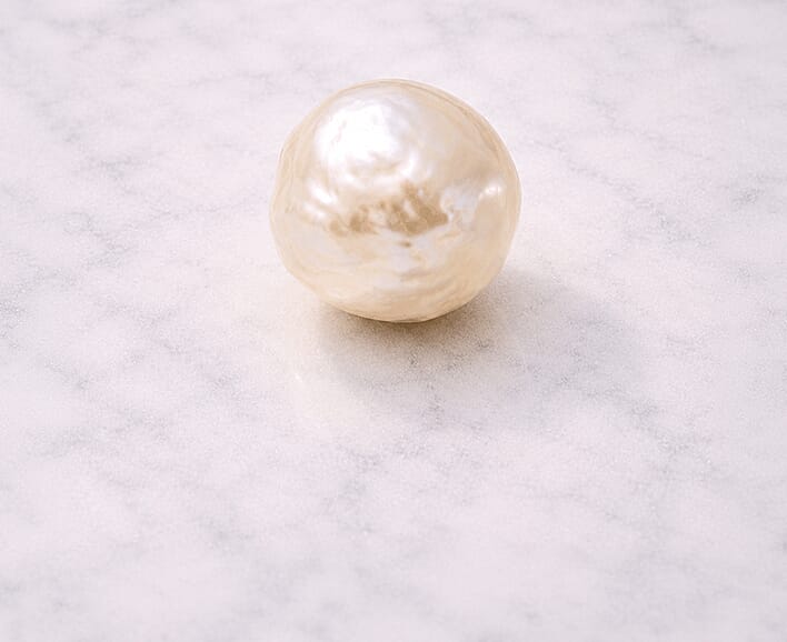 Natural pearl on marble