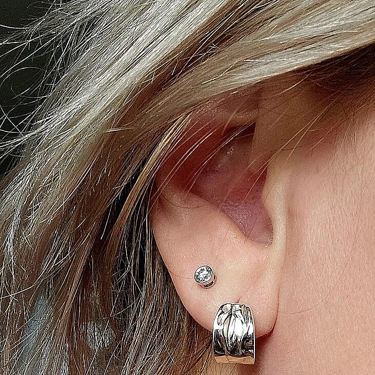 Caroline L. wearing the diamond studs